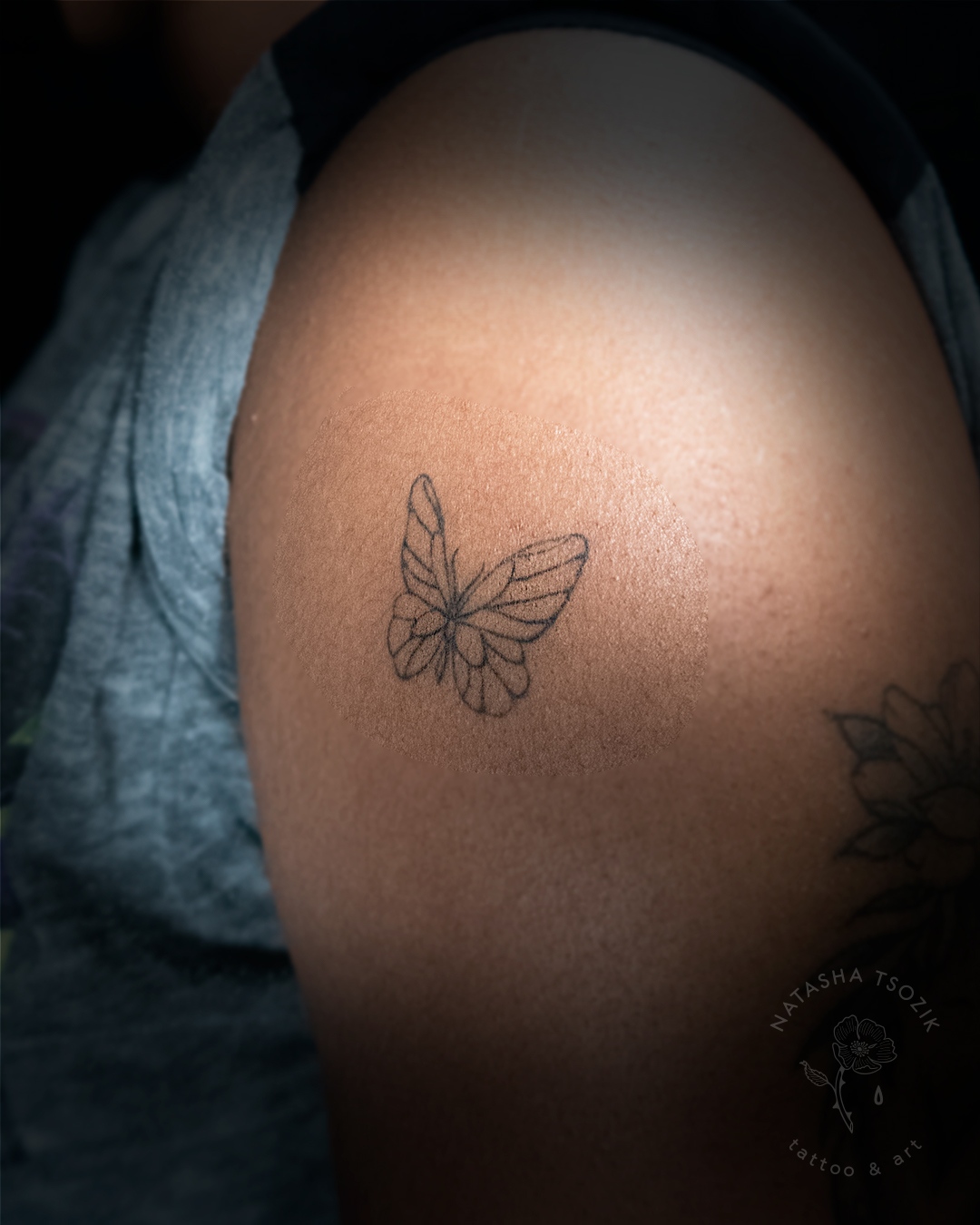 Butterfly small tattoo on arm by Natasha Tsozik