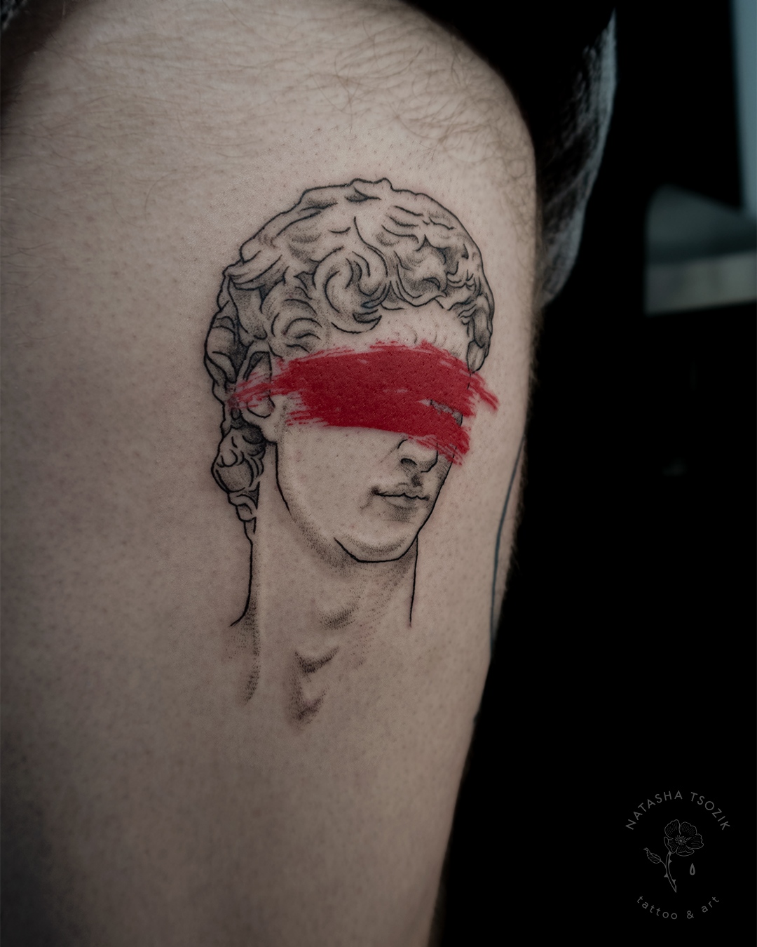 Thigh tattoo – David with a red blindfold.
