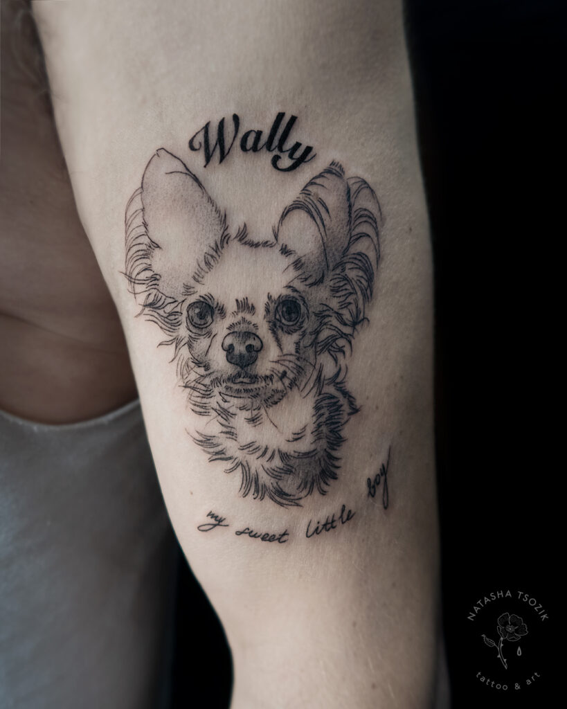 Memorial pet tattoo on a bicep.