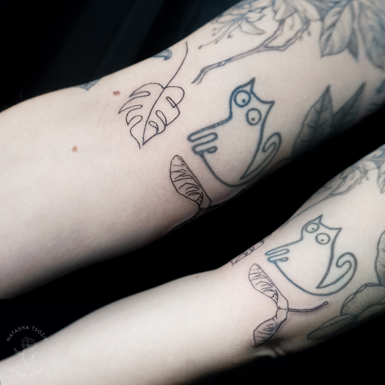 Small leaf tattoos on an arm