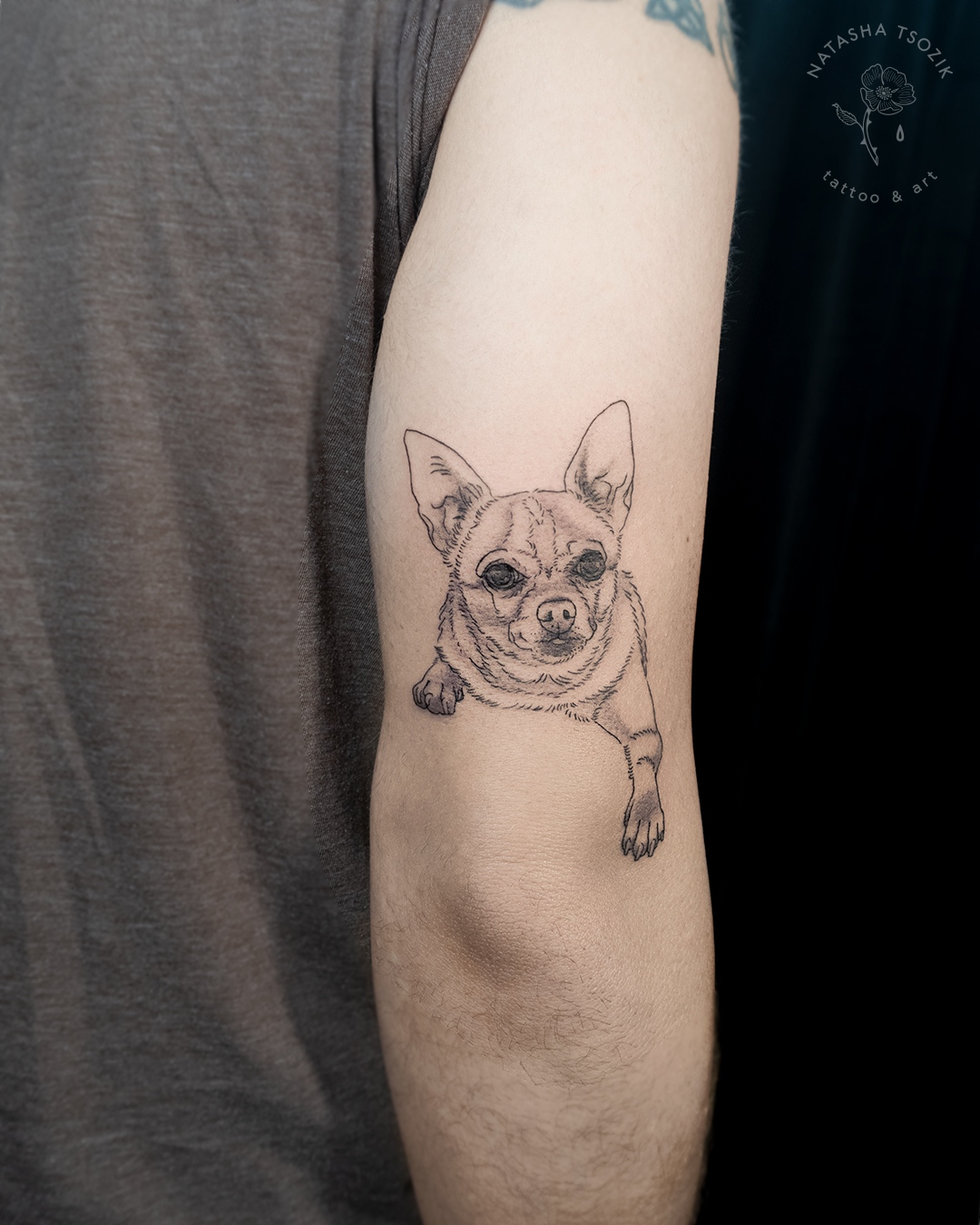 Pet portrait tattoo on an bicep.