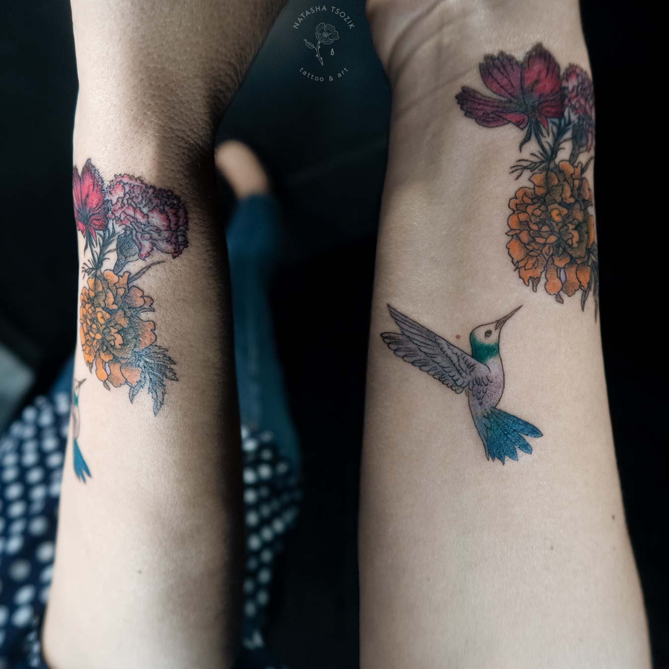 Colored hummingbird memorial tattoo on a wrist.