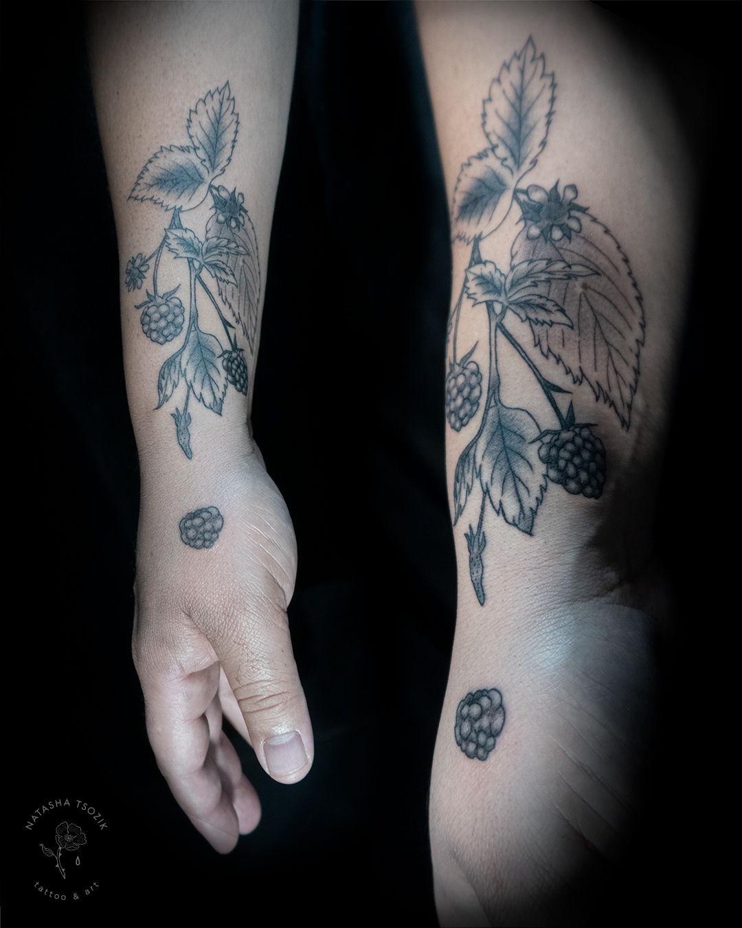 A raspberry tattoo on a forearm.
