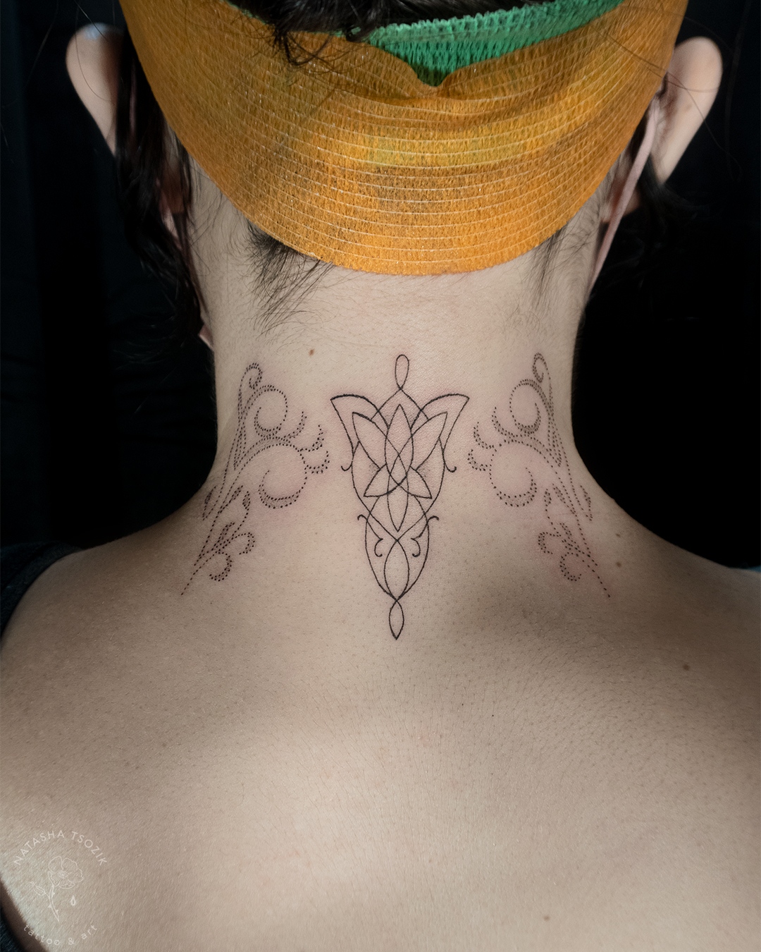 Neck tattoo by Natasha Tsozik