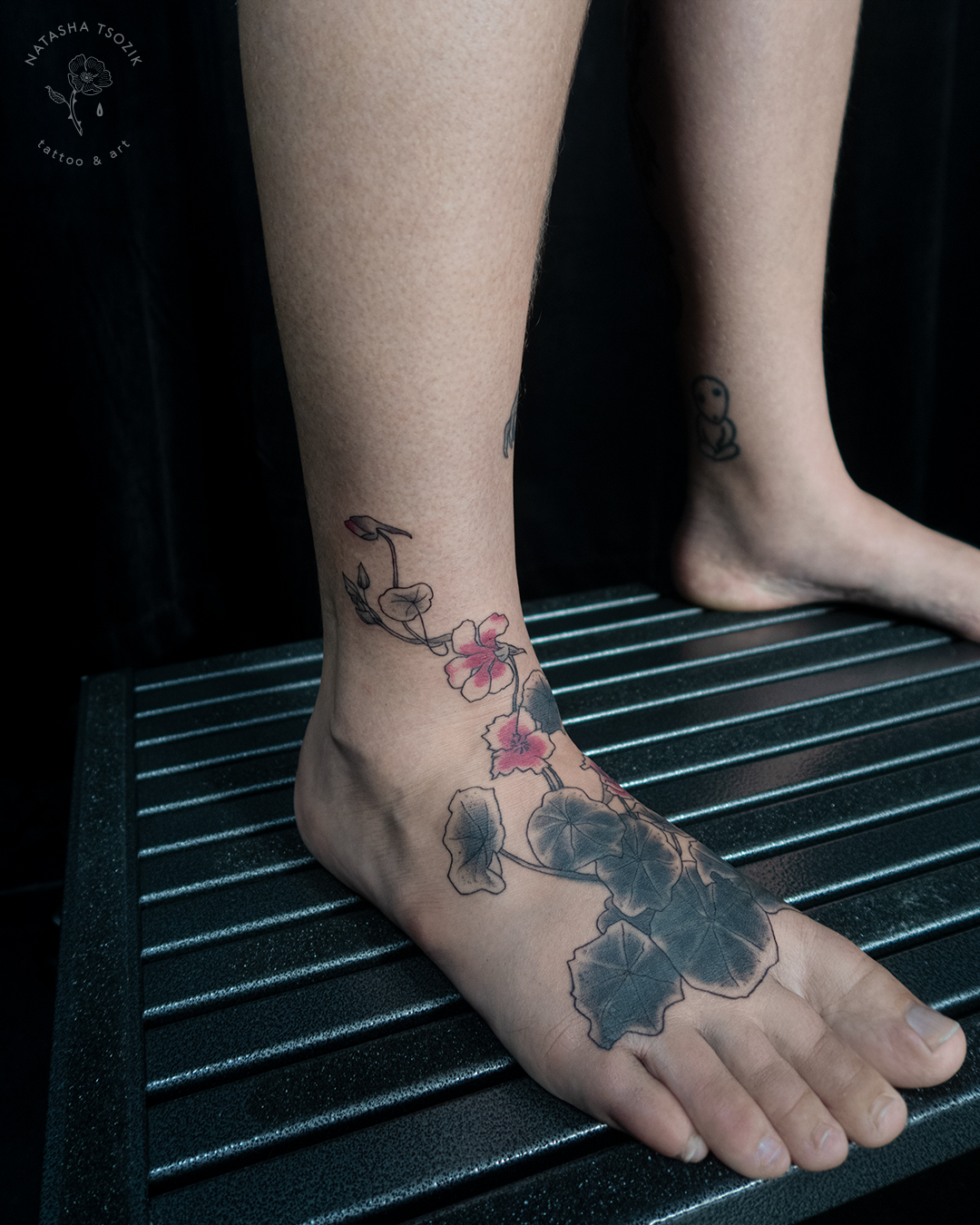 Nasturtium tattoo on a feet.