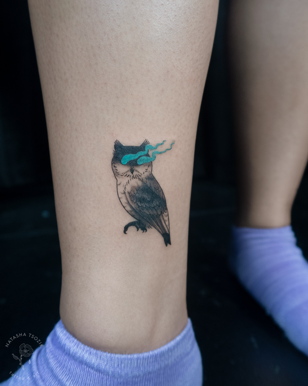 Owl tattoo on an ankle.