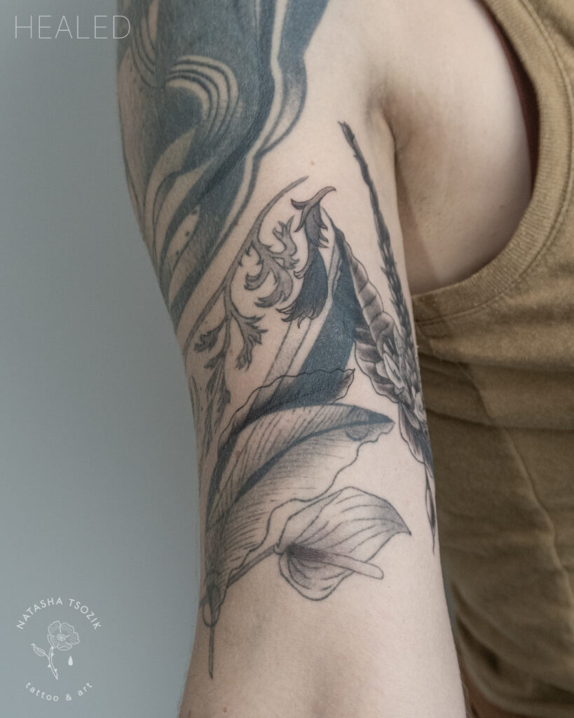 Healed tattoo of flowers by Natasha Tsozik.