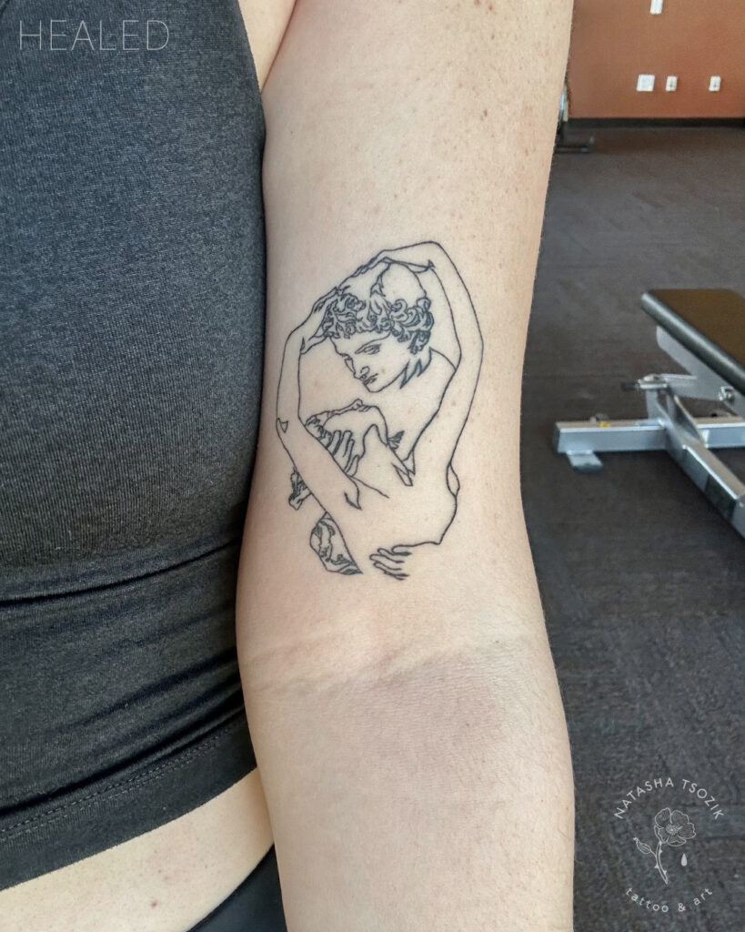 Healed line tattoo on a forearm by Natasha Tsozik.
